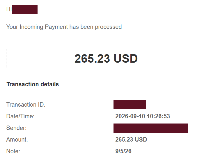 Comprovante de pagamento de 265,23 USD, com dados pessoais ocultados